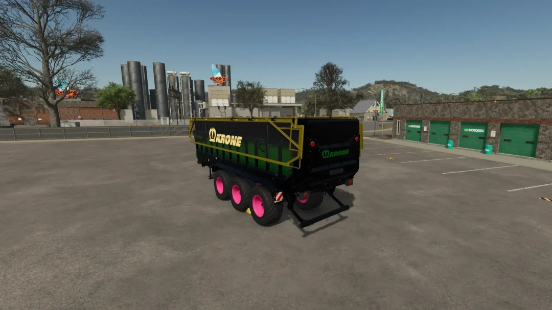 FS25 mod Krone GX520 by DraxMods v1.0.0.0 showcasing a trailer with bright pink wheels in an industrial yard.