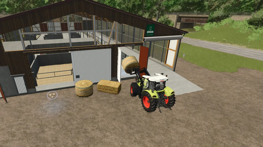 FS25 mod showing a tractor handling hay bales outside a large cowshed with a beautiful wooden facade.