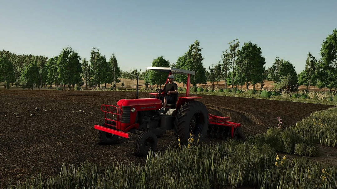 Massey Ferguson 235 tractor mod in action in Farming Simulator 25 field.