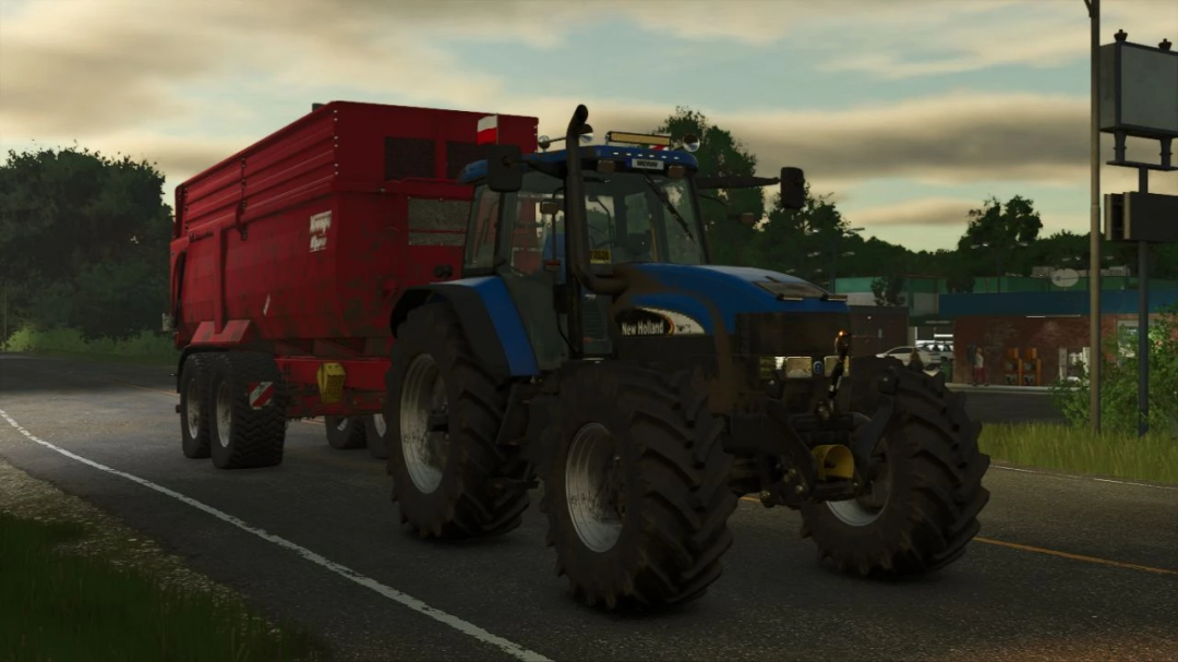 New Holland TM tractor with red trailer in FS25 mod New Holland TM Pack v1.0.0.0.