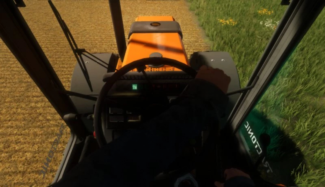 Interior view of Renault TZ tractor in FS22 mod, showing steering wheel and field ahead.