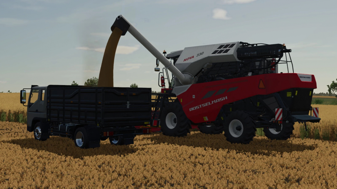 FS25 mod Rostselmash Nova 330 unloads wheat into a truck in Farming Simulator 25.