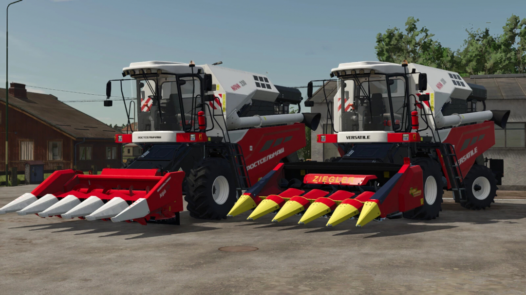 Rostselmash Nova 330 mod in FS25 showing two red combine harvesters parked side by side.