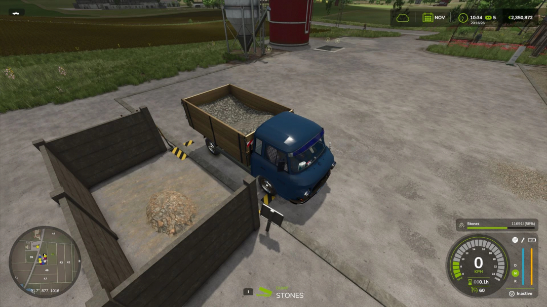 FS25 mod: Small Handmade Stone Silo with truck unloading stones in Farming Simulator 25.