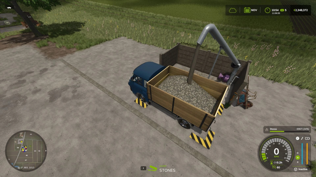 FS25 mod: Small Handmade Stone Silo v1.1.0.0 with truck loading stones in Farming Simulator 25.