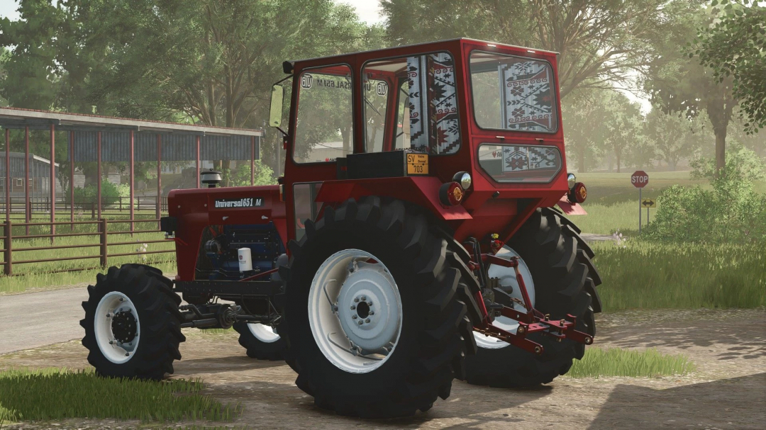 FS25 mod UTB 651 MDT tractor in a farm setting, showcasing detailed design and vibrant colors.