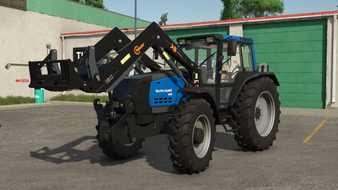 Valtra 8750 Series tractor mod for FS25 in front of a garage.