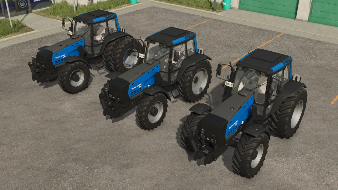 Three blue Valtra 8750 Series tractors parked in Farming Simulator 25 mod.