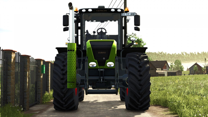 fs25-mods, Front view of Claas Xerion 3000 Series tractor mod in FS25, showcasing its robust design in a rural setting.