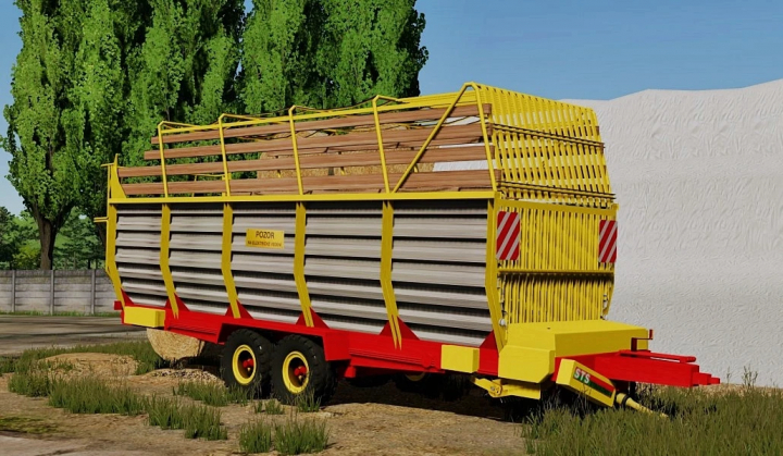 fs25-mods,  FS25 mod Horal SP3 026 trailer with yellow and red design in a field setting.