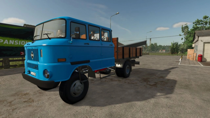 fs25-mods, Blue IFA W50 truck mod in Farming Simulator 25, featuring a trailer with wooden sides. Ideal for FS25 mods enthusiasts.