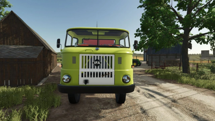 fs25-mods, The IFA W50 v1.0.0.1 truck mod for Farming Simulator 25, seen on a farm road. FS25 mods enhance farming gameplay.