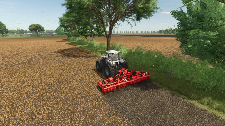 fs25-mods, FS25 mod Kuhn HR 6040 Multi v1.1.0.0 in use on a tractor, cultivating a vast field surrounded by trees.