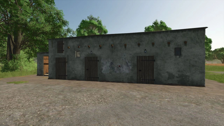 fs25-mods, Old enclosure mod in FS25, stone building with wooden doors in a rural setting.