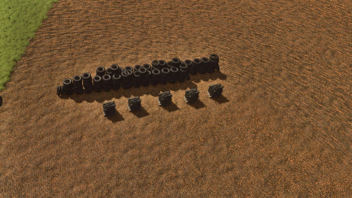 fs25-mods,  Placeable tire mod in FS25 showing stacks of tires on a field. Ideal for Farming Simulator 25 mods.