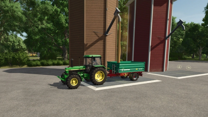 fs25-mods, Tractor with a green trailer beside a multi-fruit silo in Farming Simulator 25 mod.