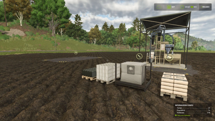 fs25-mods,  Stone Mill mod in Farming Simulator 25 with machinery and supplies on a plowed field, surrounded by trees.