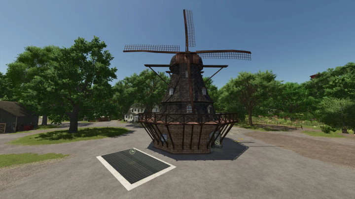 fs25-mods,  Windmill mod in Farming Simulator 25, set in a lush, tree-filled landscape.