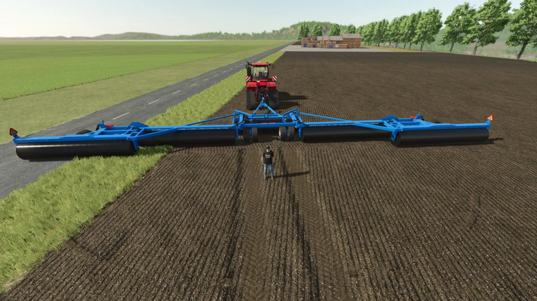 FS25 mod Brandt 591A Edit v1.0.0.0 in action, a blue agricultural roller attached to a red tractor on a farm field.