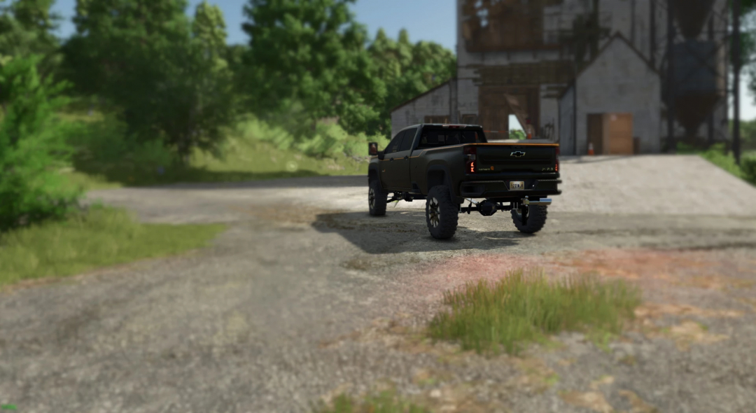 FS25 mod Carhartt Silverado V1.0.0.0, featuring a black pickup truck on a farm road.