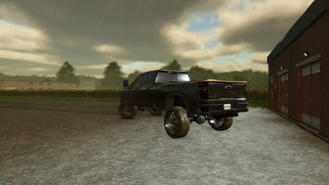 Carhartt Silverado mod in FS25, parked near a barn under cloudy skies.