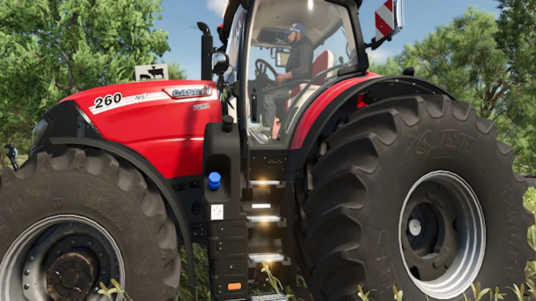 Case IH Puma tractor mod in FS25 showing detailed red design and large tires.