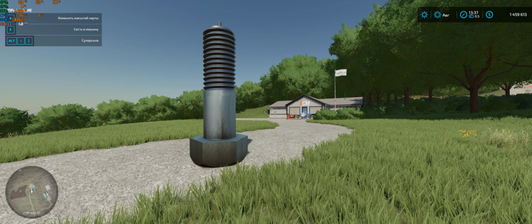 Large bolt mod in FS22 landscape, surrounded by grass and trees, with a building in the background.