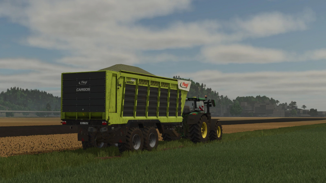 FS25 mods: Fliegl CARGOS 750/760 trailer on a field, Farming Simulator 25.