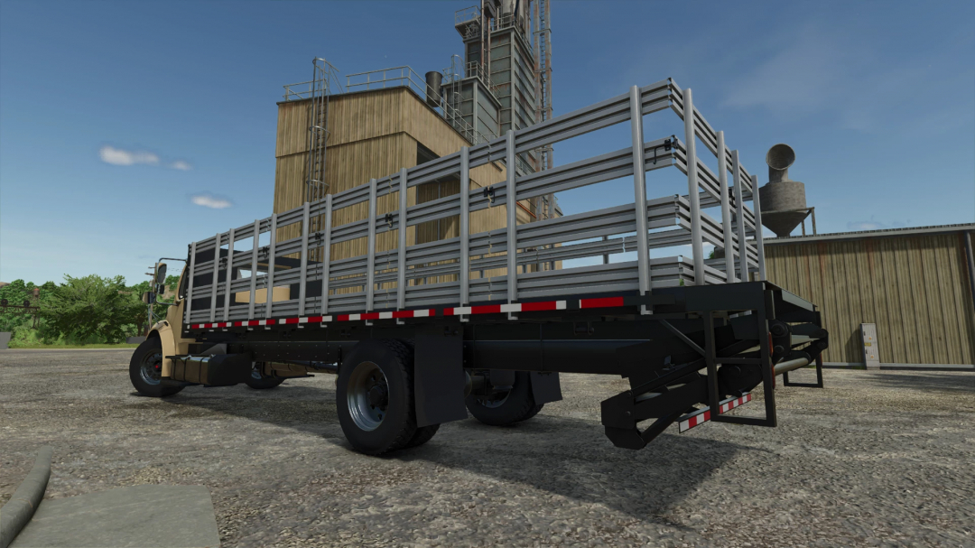 Freightliner M2 Stakebed AutoLoad mod in FS25 at a farm setting.