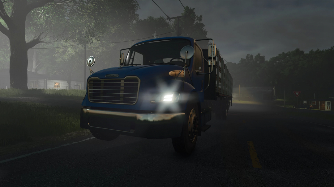 Freightliner M2 Stakebed AutoLoad mod in FS25, parked on a foggy road.