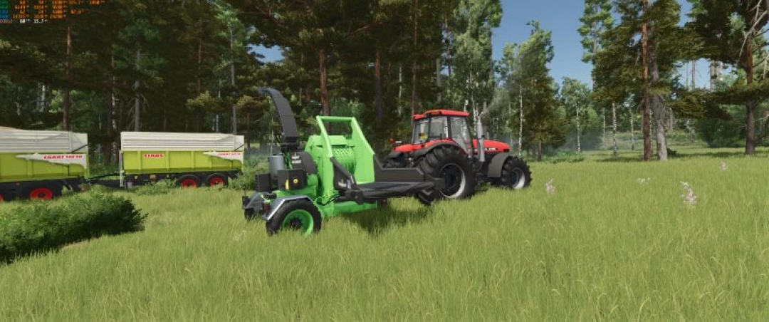 Heizomat HM 10-500 KF mod in FS25, with a red tractor in a grassy field, showcasing Farming Simulator 25 mods.