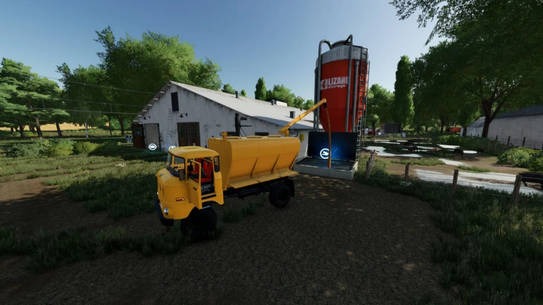 IFA BABOLNA mod for FS22, featuring a yellow truck parked near a red silo in Farming Simulator 22.