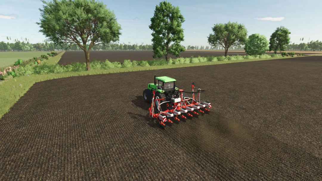 Tractor using Kuhn MAXIMA Multi mod in FS25, planting crops in a vast field with surrounding trees.