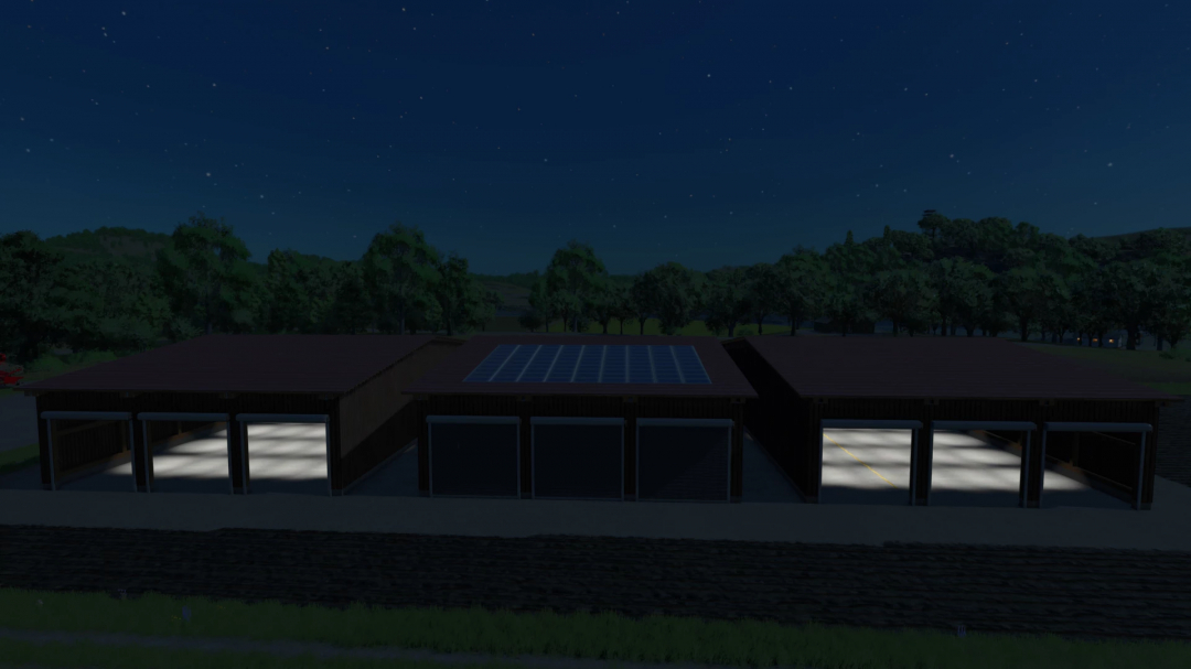 FS25 mod LSFM Drive Through Hall Pack at night with garage doors open, solar panels on roof, surrounded by trees.