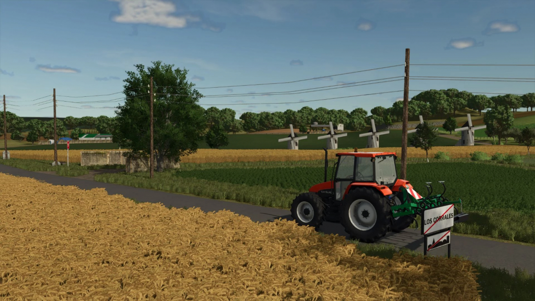 Tractor on a country road in FS25 Los Corrales mod, with fields and windmills in the background.