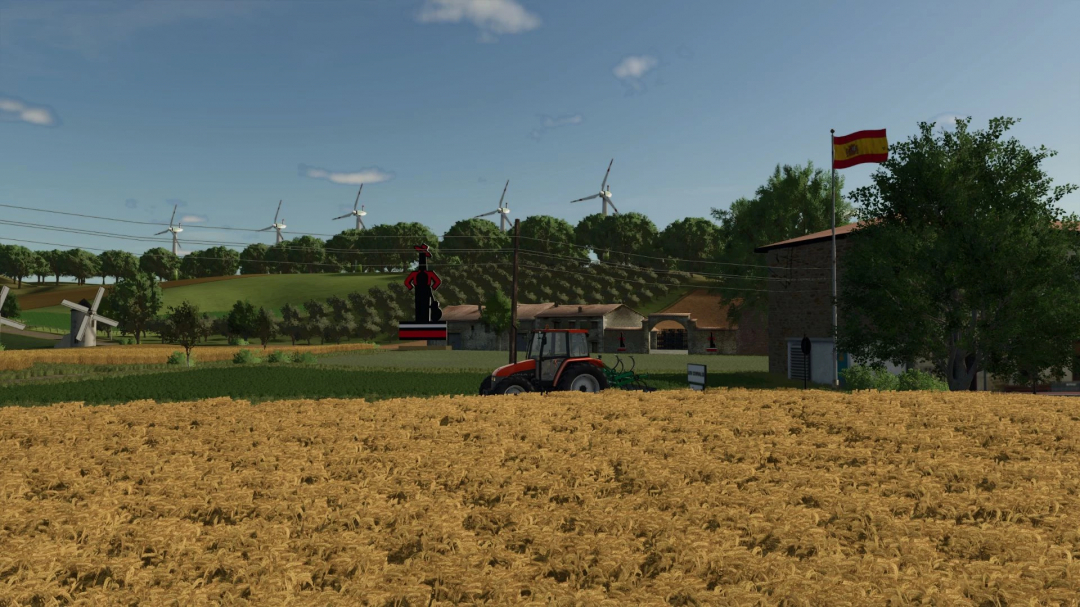 FS25 mod Los Corrales 2K25 v1.0.0.0 features a farm landscape with a tractor, wind turbines, and Spanish flag.