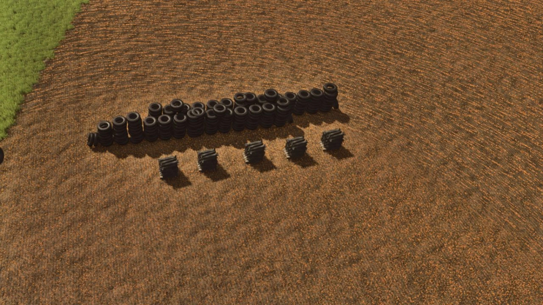 Placeable tire mod in FS25 showing stacks of tires on a field. Ideal for Farming Simulator 25 mods.