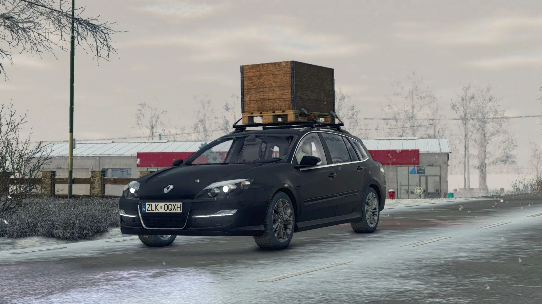 Renault Laguna III ph.2 Grandtour mod in FS25 with wooden crate on roof, winter landscape.