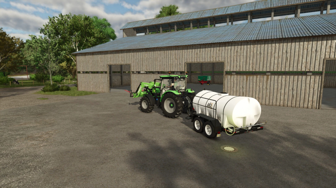 FS25 mod Sewage Shaft v1.0.0.0: Tractor with tank trailer by a wooden barn