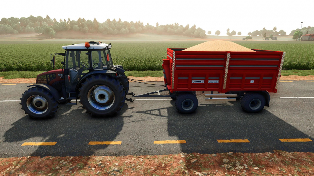 FS25 mod showing Ugurlu Agricultural Trailer 5T attached to tractor on road with fields in background.