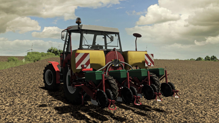 fs25-mods,  FS25 mod Meprozet S100 v1.0.0.0, a tractor in a field with planting equipment under a cloudy sky.