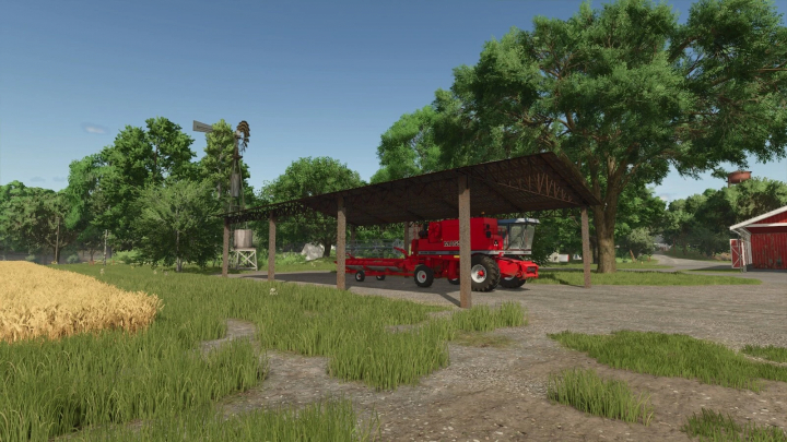 fs25-mods,  Old Brazilian Shed mod in FS25 featuring a red harvester under a wooden structure surrounded by green fields and trees.