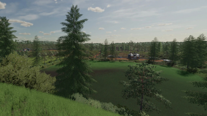 fs22-mods, Lush green landscape of Pertile Map in FS22 mods, featuring trees and farm structures under a clear sky.