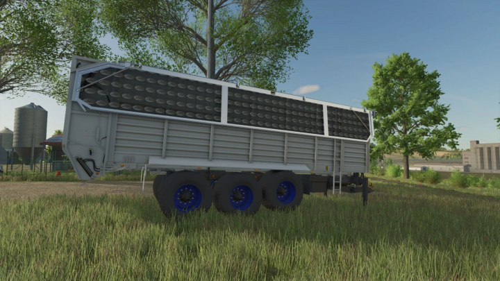 fs25-mods,  FS25 mod Philibert T56P trailer parked in a farm field, showcasing its design in Farming Simulator 25.