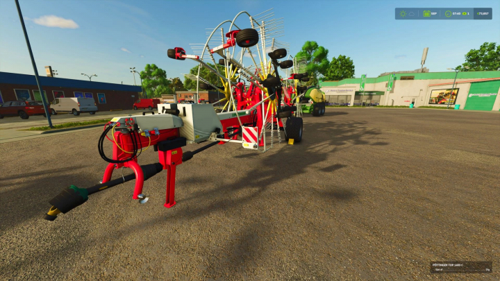 fs25-mods, FS25 mod Pöttinger Top 1403 C with attach in a garage setting, Farming Simulator 25.