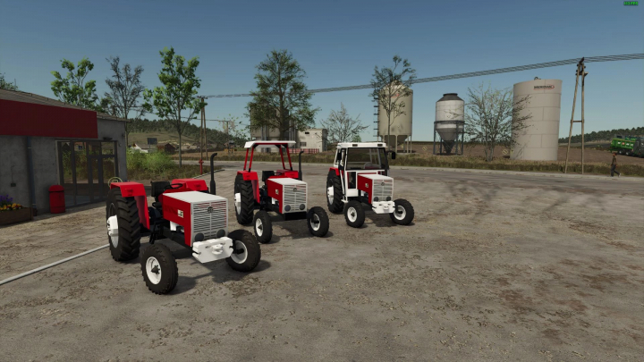 fs25-mods,  Three Steyr 8073 tractors parked in Farming Simulator 25, showcasing the FS25 mod details with silos in the background.