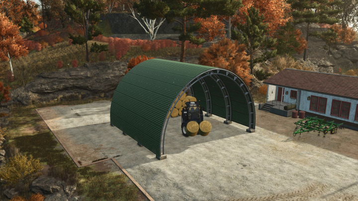 fs25-mods,  FS25 Storage Tunnel Pack mod showing a green metal tunnel with hay bales and a tractor in a scenic autumn landscape.