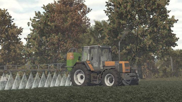 fs25-mods, FS25 mod Tolmet Klara 1015 v1.0.0.0, tractor spraying field with trees in background.