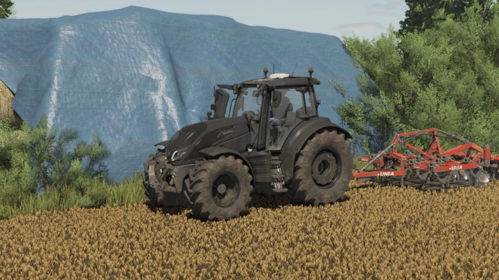 fs25-mods,  FS25 mod: Unia Cross L Drive v1.0.0.0, a black tractor with a plow in a field, Farming Simulator 25 scene