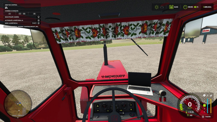 fs25-mods,  Interior of Universal 650M tractor mod in FS25, showing dashboard and laptop. Part of Farming Simulator 25 mods.